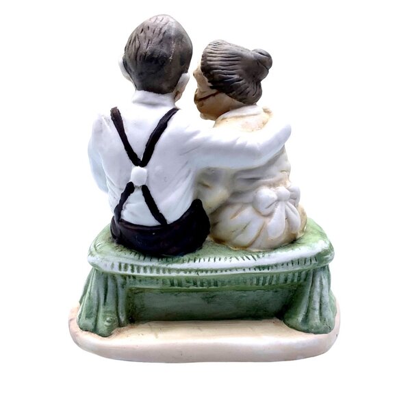 Vintage Figurine Of Elderly Couple Sitting On A Bench With Glasses & Red Bow Tie - Picture 3 of 7